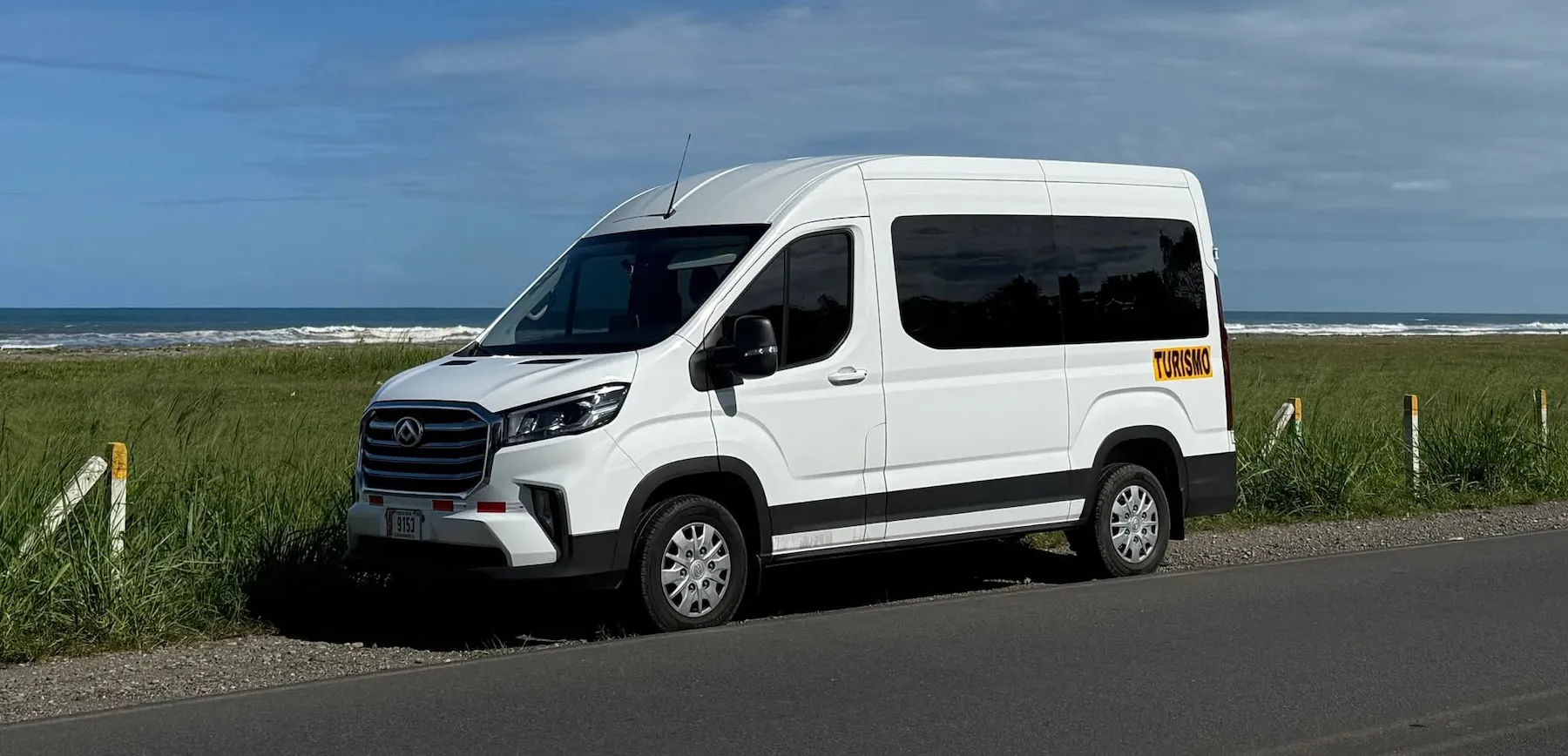 Go Arenal Travel van on a rainforest road in Costa Rica